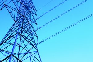  | A high-power electric distribution tower with a blue sky background